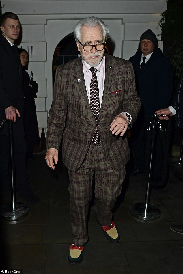He turned heads in a pair of extravagant red, tan and black suede loafers and added a burgundy patterned tie.