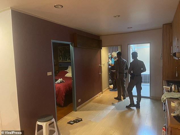 The Scottish suspects, identified only as 'William' and 'John', allegedly met Burmese national Kyaw Zeyar, 50, for a business deal at the Saranjai Mansion apartment block (pictured as police investigate) in Bangkok on Tuesday night.