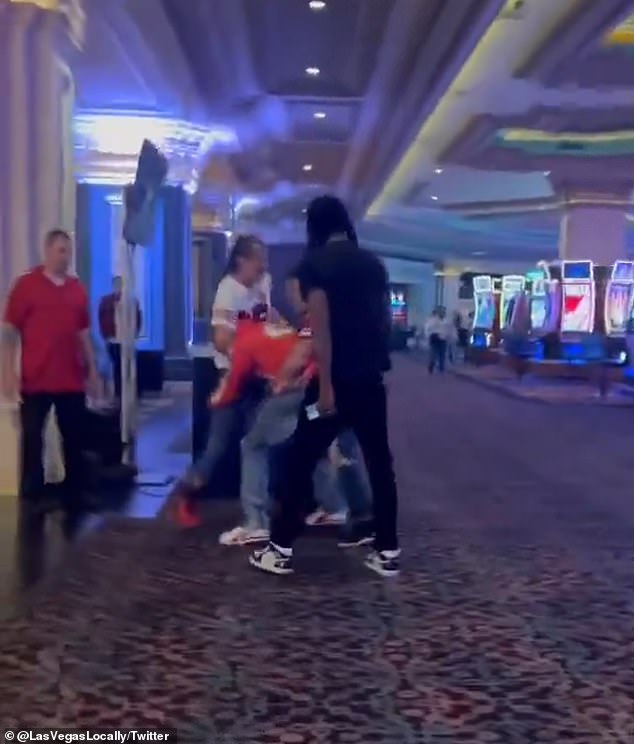 The group of four men, a mix of fans from Kansas City and San Francisco, can be seen fighting each other while on the casino floor.