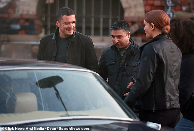 Bloom appeared to share a joke with co-stars Howard and Nick Mohammed during a break between scenes on Wednesday.