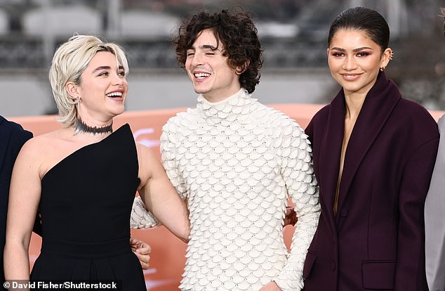 The actress, 27 (right), who plays Chani in the upcoming sci-fi epic, cut a sophisticated figure in a structured purple suit as she posed with Florence (left) and Timothée.