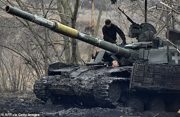 Ukrainian servicemen check their tank after maintenance not far from Bakhmut, Donetsk region, on February 5.