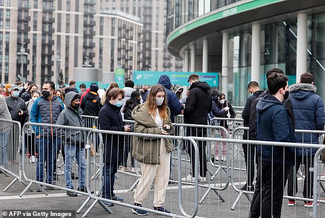 Some 157 million Covid vaccines have been delivered in England since its rollout began in December 2020. Pictured: People queuing outside Wembley Stadium to receive a Covid jab in December 2021.