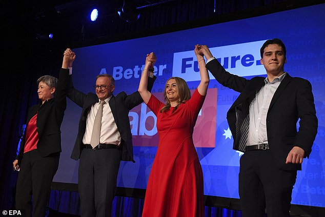 Albanese claimed victory for Labor and appeared on stage with MP Penny Wong (left), her partner Jodie Haydon (centre) and her son Nathan (right).