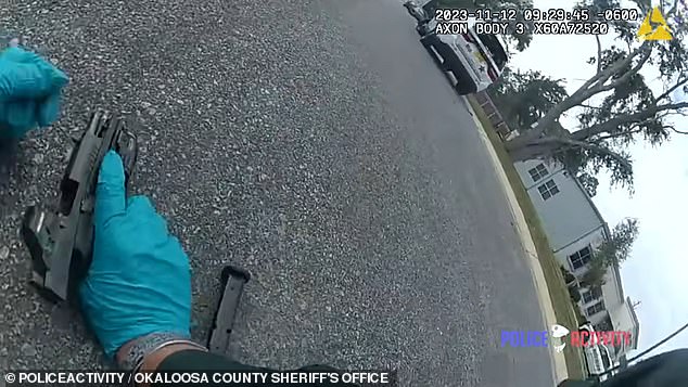 Body camera of officer crouching to the ground, saying he was hit, when he wasn't