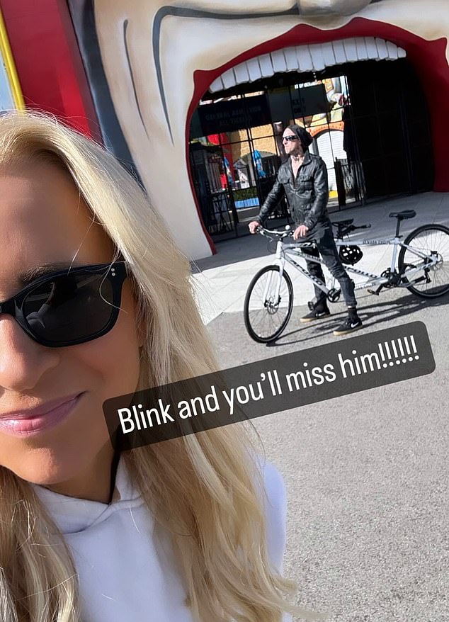 In a surprise image posted online, the radio host, 43, smiled as she posed for a selfie outside the theme park with the Blink-182 drummer, 48, in the background.