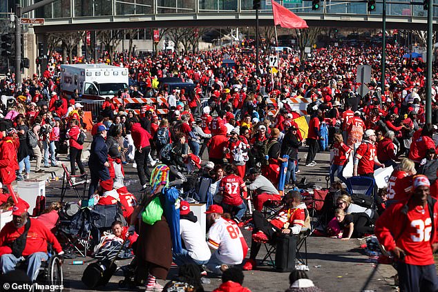 A frantic crowd is seen falling to the ground after shots were fired during the celebration parade in Kansas City, Missouri.