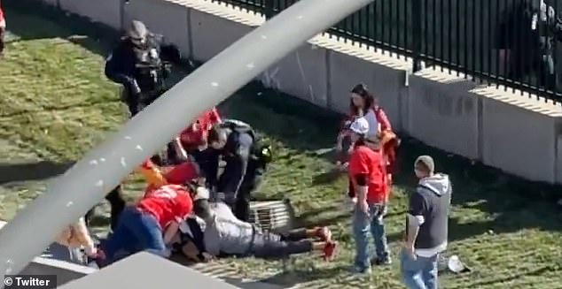 A group of brave fans are able to tackle the suspect and hold him down while the rest of the crowd runs to safety.