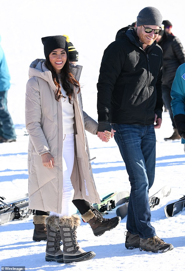 Meghan looked happy as she held Harry's hand in Canada on Valentine's Day.