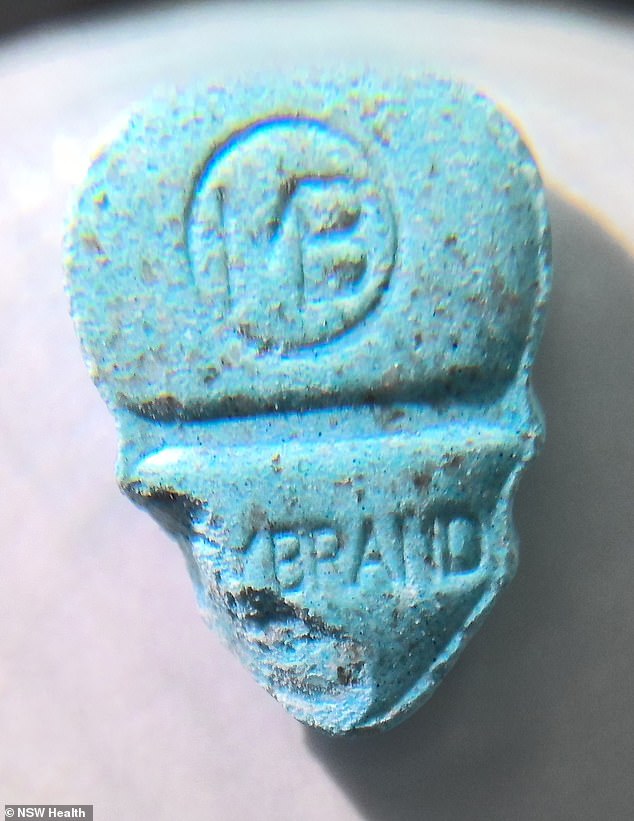 The skull-shaped tablets have the word 'MYBRAND' and are blue or pink/orange in colour.