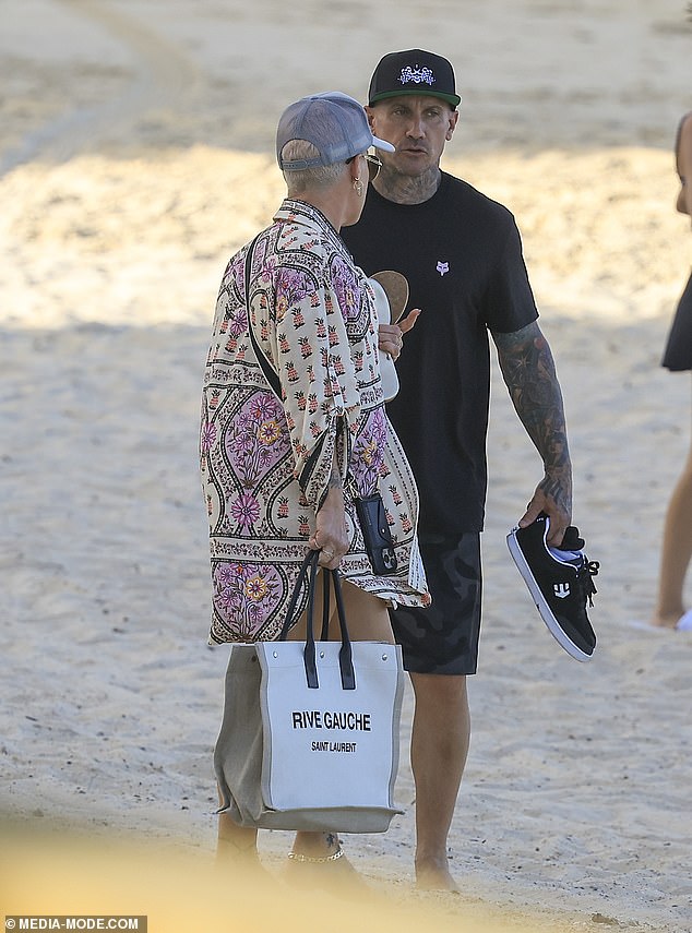Pink was seen chatting with her husband Carey