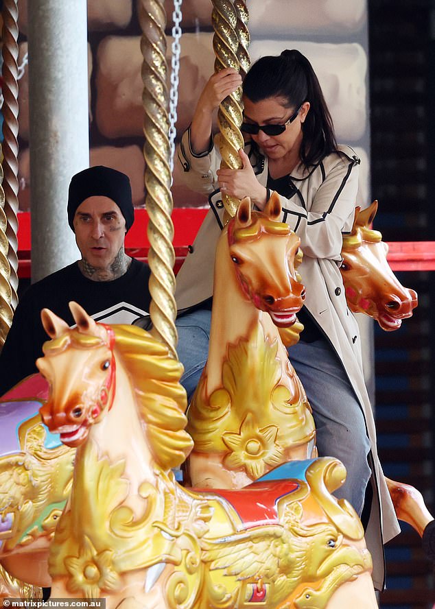Travis and Kourtney rode a carousel
