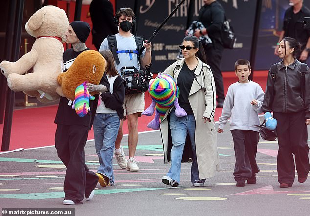 On Wednesday, the couple were spotted at Luna amusement park in Sydney with Kourtney's daughter Penelope, 11, and son Reign, nine, who she shares with ex Scott Disick, 40.