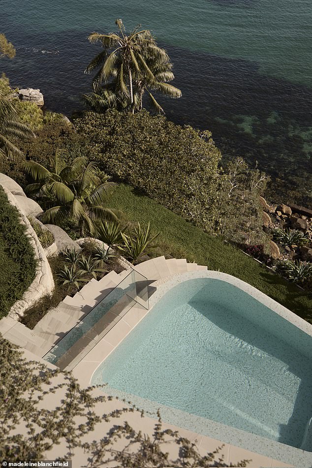 Another image showed a beautiful pool built right on the coast and surrounded by sculpted gardens and palm trees.