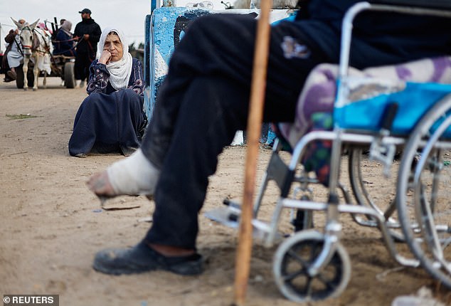 Palestinian patients rest upon arrival in Rafah after being evacuated from the Nasser hospital in Khan Younis due to the Israeli ground operation.