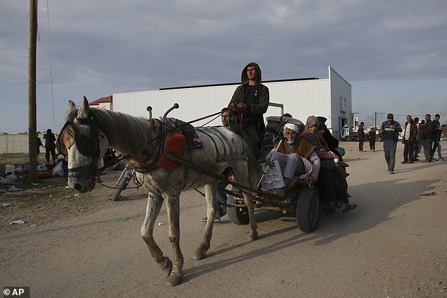 Palestinians fleeing the Israeli offensive on Khan Younis arrive in Rafah, Gaza Strip