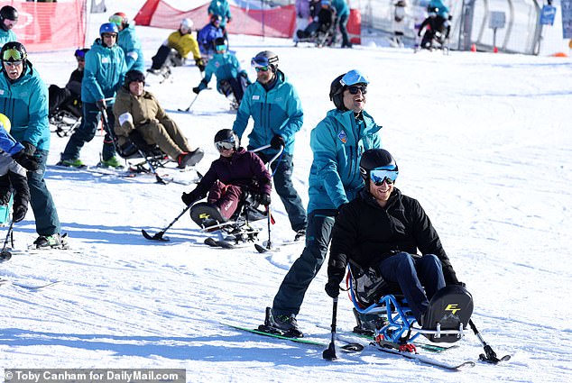 Harry was all smiles as they helped him sit-ski.