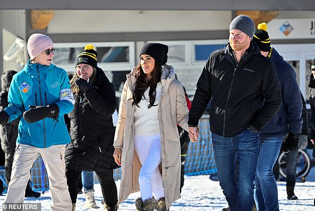 The Sussexes were arm in arm as they were taken to the slopes.
