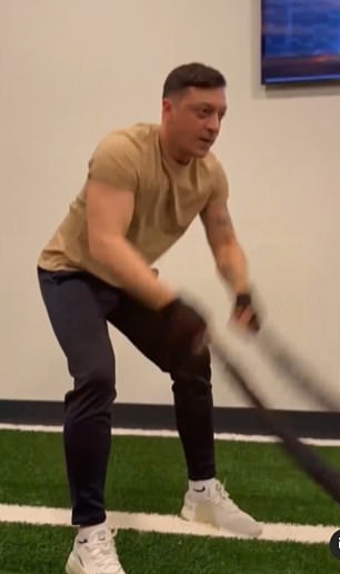 The former Arsenal midfielder was filmed performing battle ropes exercises