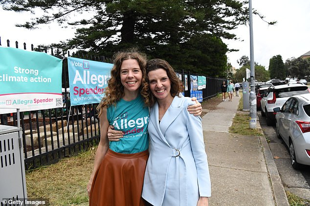 Allegra Spender (right), independent candidate for Wentworth, hugs her sister Bianca Spender outside Bondi Beach Public School on Saturday (pictured)