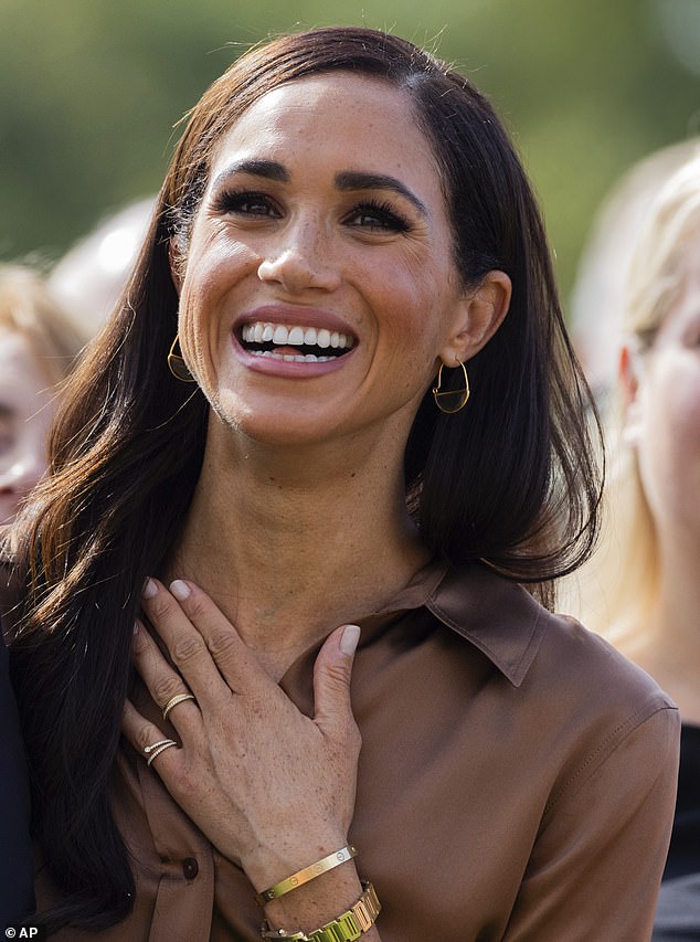 Meghan Markle ditched her mystery pinky ring made by famed jeweler Lorraine Schwartz, for a 1972 tennis pinky ring by Shiffon and Co today (pictured)