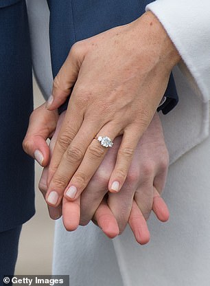 Prince Harry proposed to Meghan in November 2017 with a sparkling ring comprised of a solid yellow gold band set with three diamonds.