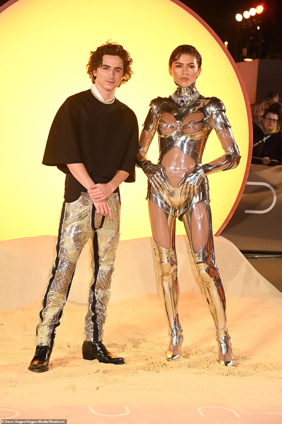 Zendaya also rocked a pair of silver gloves along with matching knee-high boots while posing with her co-star Timothee Chalamet.