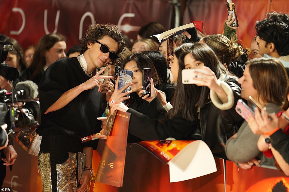 Timothee was in demand at the premiere as he posed for photographs with several fans.