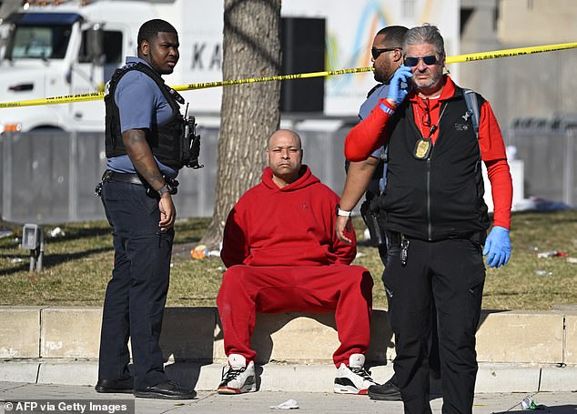 A man dressed in a red tracksuit was quickly detained after the shooting, although it is unclear if he was involved in the tragedy.