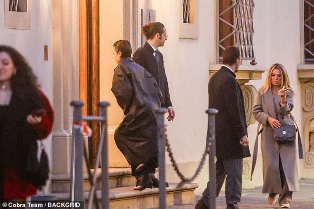 Bianca was wrapped in a black leather coat during the Italian getaway