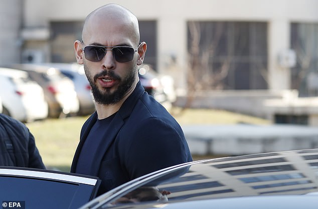 Former professional kickboxer and social media influencer Andrew Tate enters a limousine as he leaves after a pre-trial hearing at the Bucharest Court in Romania.