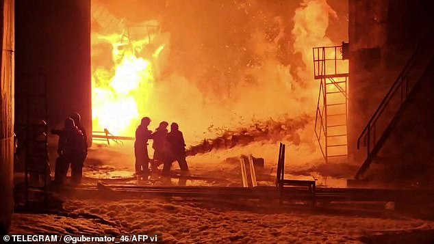 Firefighters working to extinguish a fire at an oil depot in the Kursk region.