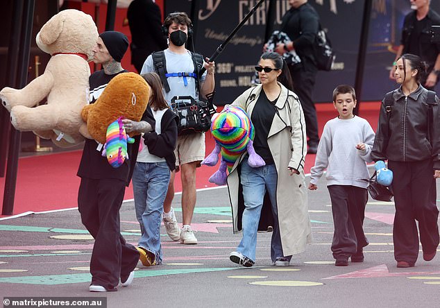 On Wednesday, the couple were spotted at Luna amusement park in Sydney with Kourtney's daughter Penelope, 11, and son Reign, nine, who she shares with ex Scott Disick, 40.