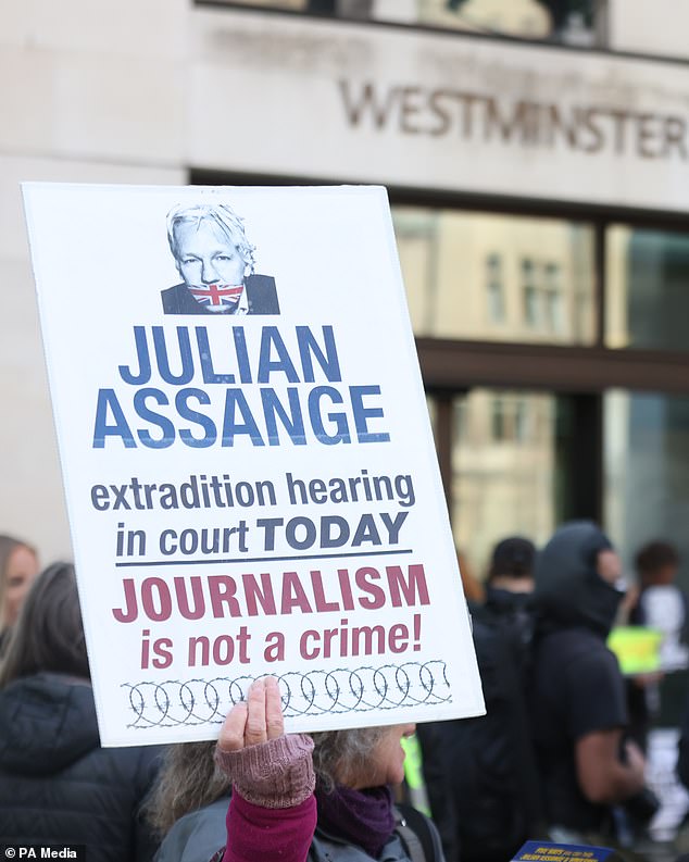 Supporters of Wikileaks founder Julian Assange protest outside Westminster Magistrates' Court.