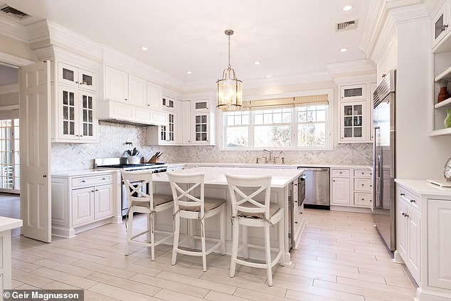 In 2018, the listing notes, the Hiltons renovated the gourmet kitchen (pictured), all the bathrooms and the large master suite.