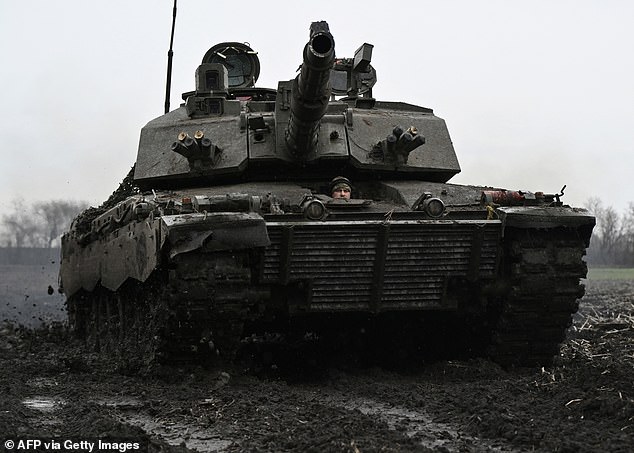A Ukrainian serviceman from the 82nd Separate Air Assault Brigade drives a Challenger 2 tank at an undisclosed location near the front line in the Zaporizhzhia region, February 12, 2024.