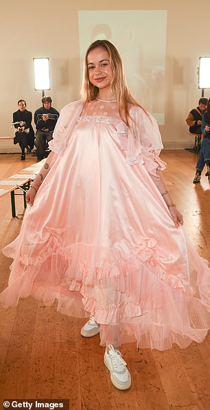 Lady Amelia Windsor opted for a baby pink satin dress with multiple layers and ruffles, as well as beaded details and bows.