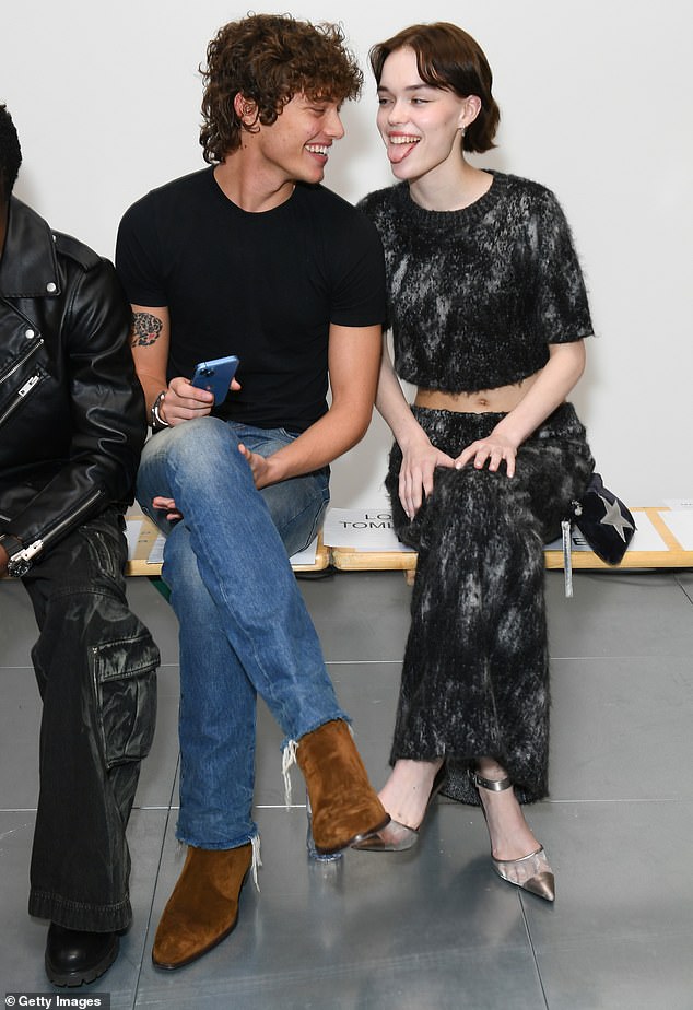 The Strictly Come Dancing finalist made faces with TikToker and socialite Delphi at the Mark Fast show at Orchard Place, The Broadway, and wore a black T-shirt and blue jeans.