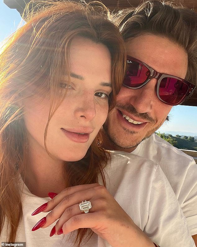Bella showed off her multi-carat emerald-cut diamond engagement ring prominently in a photo accompanying the engagement announcement in May 2023.