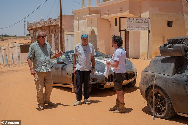 The challenge saw the trio follow in the footsteps of the world's most dangerous race, the iconic Paris-Dakar, however instead of custom-built sports cars, they must travel in second-hand engines (LR) Jeremy Clarkson, James May, Richard Hammond