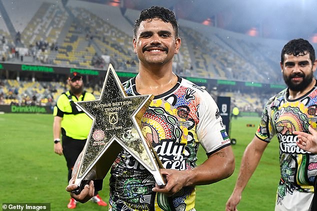Indigenous All Stars captain Latrell Mitchell poses with the Arthur Beetson Trophy