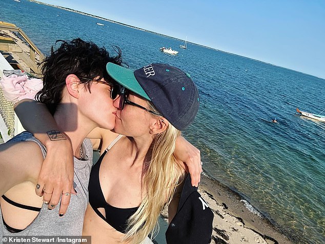 'Happy Valentine's Day to my number one crush, the sexiest cat mom in the game. I'm very interested in you,' she captioned the post. The Instagram post began with a cute picture of the couple sharing a kiss on the beach, followed by a sillier photo of the duo.