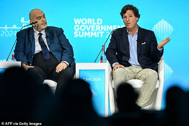 Egyptian journalist Emad El Din Adeeb (left) interviews Mr. Carlson at the World Government Summit in Dubai on Monday, February 12.