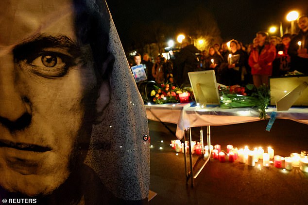 People attend a vigil in memory of Navalny in Munich, Germany.