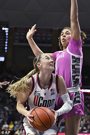 UConn guard Paige Bueckers looks for a shot next to Georgetown's Kelsey Ransom