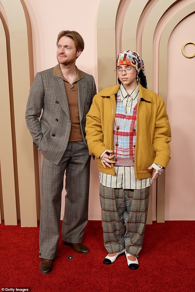 Billie attended the event accompanied by her brother and collaborator Finneas O'Connell, 26, who paired her with a plaid suit and a brown collared shirt.