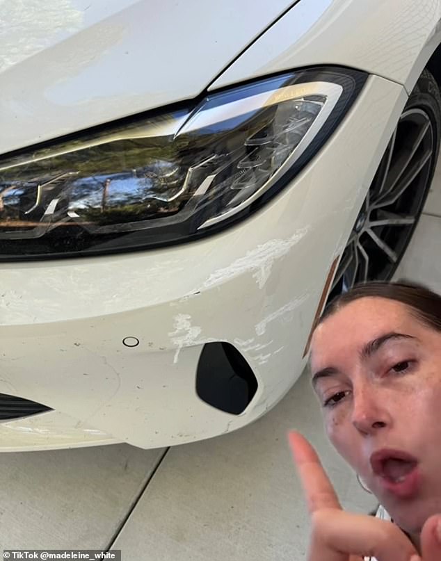 Sharing a snap of the DIY repair work in the background, Maddie said: 'No, I didn't just find damage to my car. I found damage, in addition to Wite Out from Staples or some derivative'