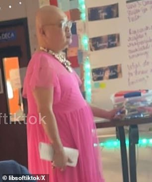 Tjachyadi's pink dress seemed to arrive in the classroom