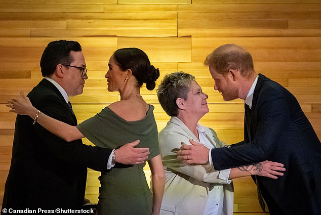 Left to right: Squamish Nation Councilor Wilson Williams, Meghan, Duchess of Sussex, Tsleil-Waututh Nation Chief Jen Thomas, and Prince Harry, Duke of Sussex, exchange greetings after receiving blankets during dinner in Vancouver on Friday.