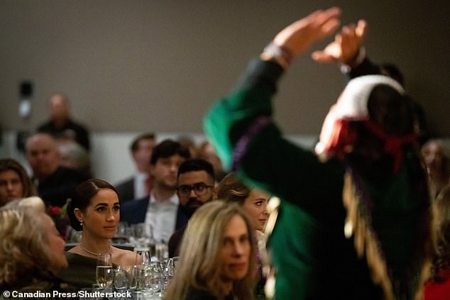 Meghan, the Duchess of Sussex, watches the Tsleil-Waututh Nation dancers perform during the "one year left" Invictus Games Dinner in Vancouver on Friday, February 16, 2024